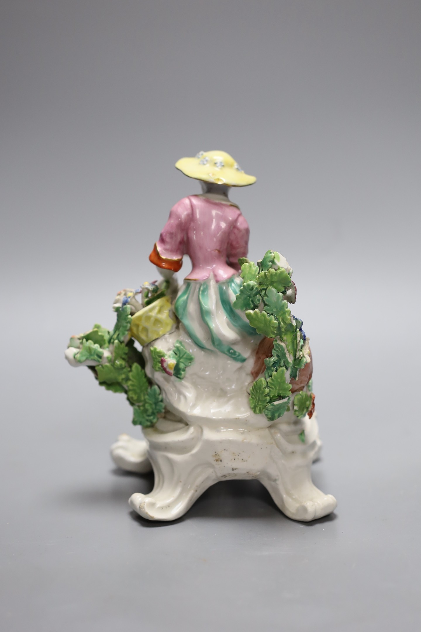 A Bow good figure of Spring on a scroll moulded base painted with flowers, having an anchor dagger mark in red, 16 cms high